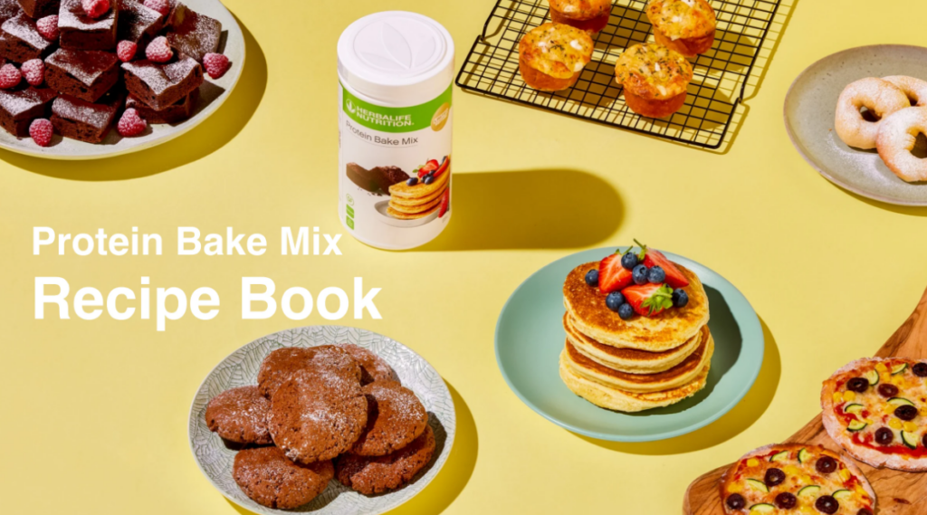 Herbalife Protein Bake Mix canister surrounded by healthy baked goods including high-protein pancakes with berries, muffins, cookies, brownies, and mini pizzas on a yellow background.